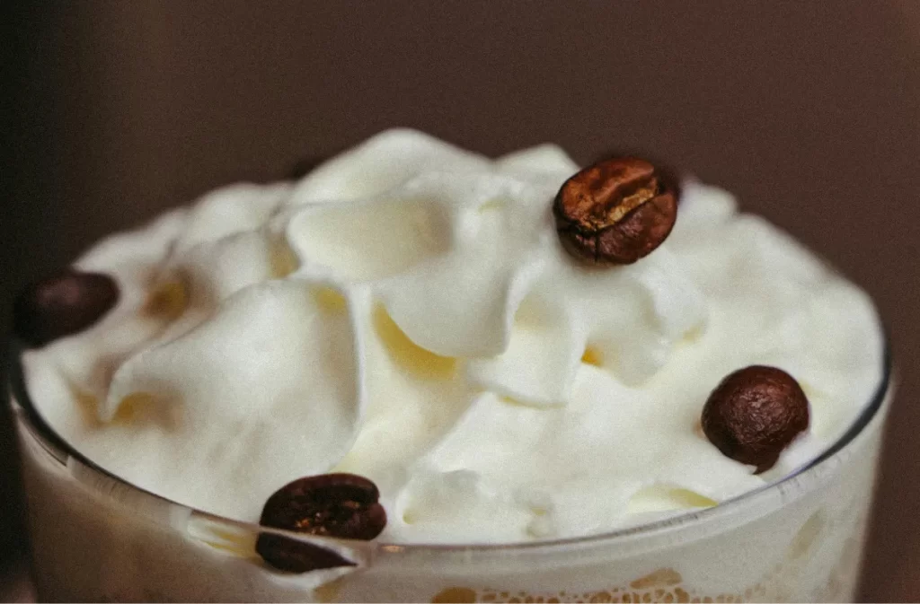 Whipped maple iced coffee with coffee beans topping