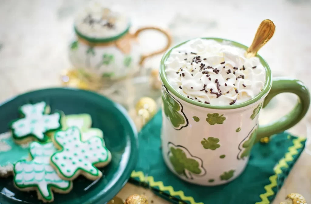 Festive whipped maple iced coffee with whipped cream topping."