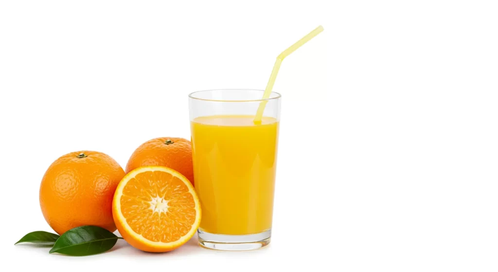 Fresh squeezed orange juice served in a glass with a yellow straw.